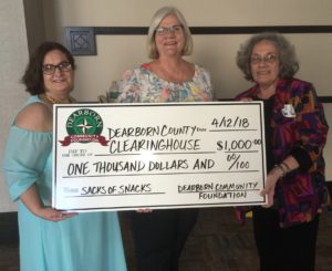 Karry Hollan, Director of Dearborn County Clearinghouse, left, and Clearinghouse volunteer Pat Paul receive a $1,000 grant check from DCF Board member Jada Ankenbauer, Center. The grant monies are for the Clearinghouse’s Sacks of Snacks program to help elementary age students who sometimes go without enough food on weekends.