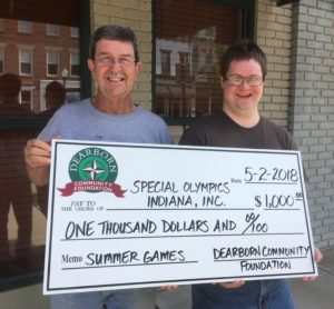 Dearborn Community Foundation Board member Bill Ward, left, delivers a $1,000 grant check to Special Olympian Ian Alexander. The DCF grant monies are to help athletes involved in Special Olympics Indiana Ripley-Ohio-Dearborn Counties to attend the 2018 Summer Olympics.